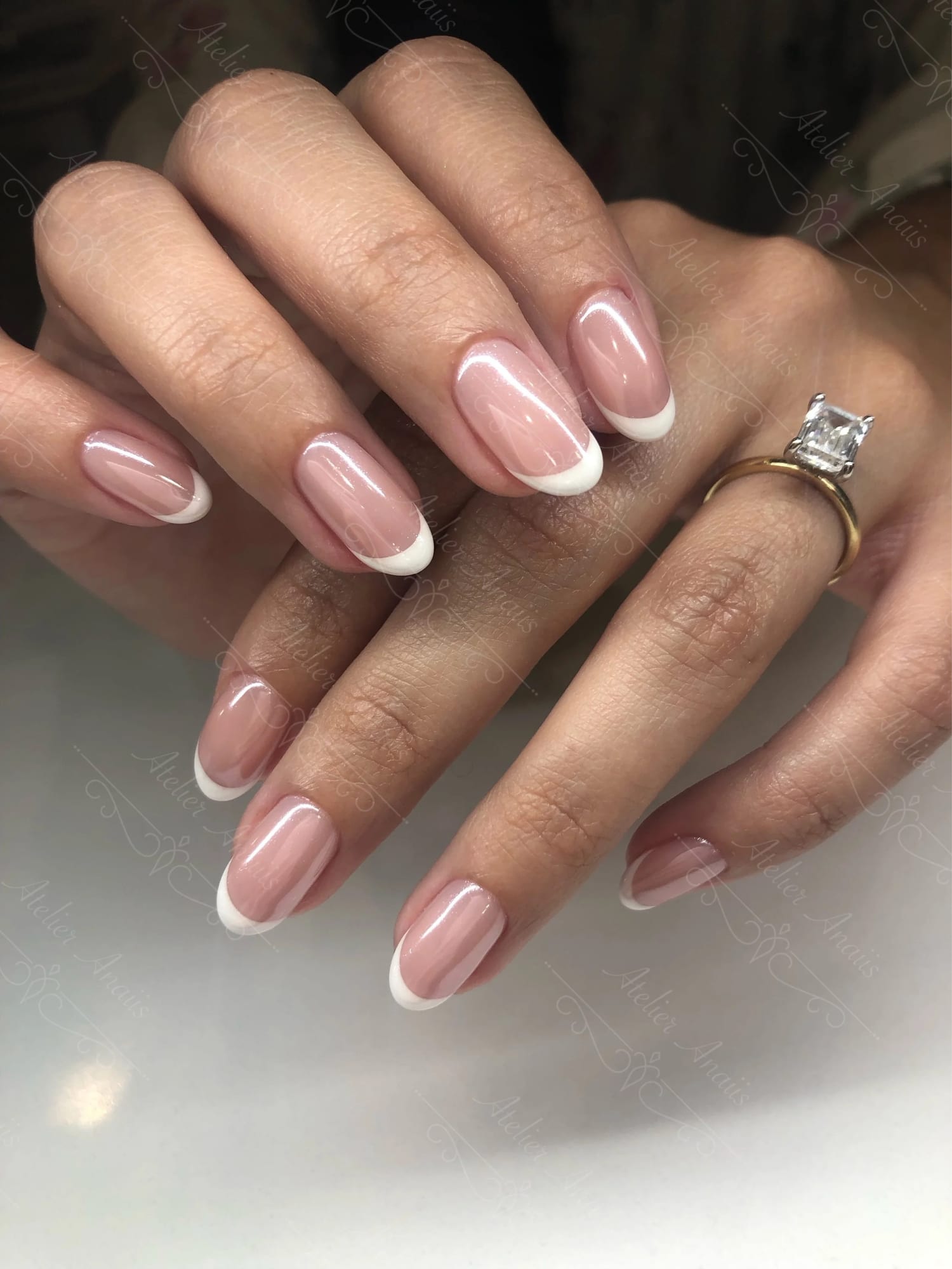French manicure with a diamond ring
