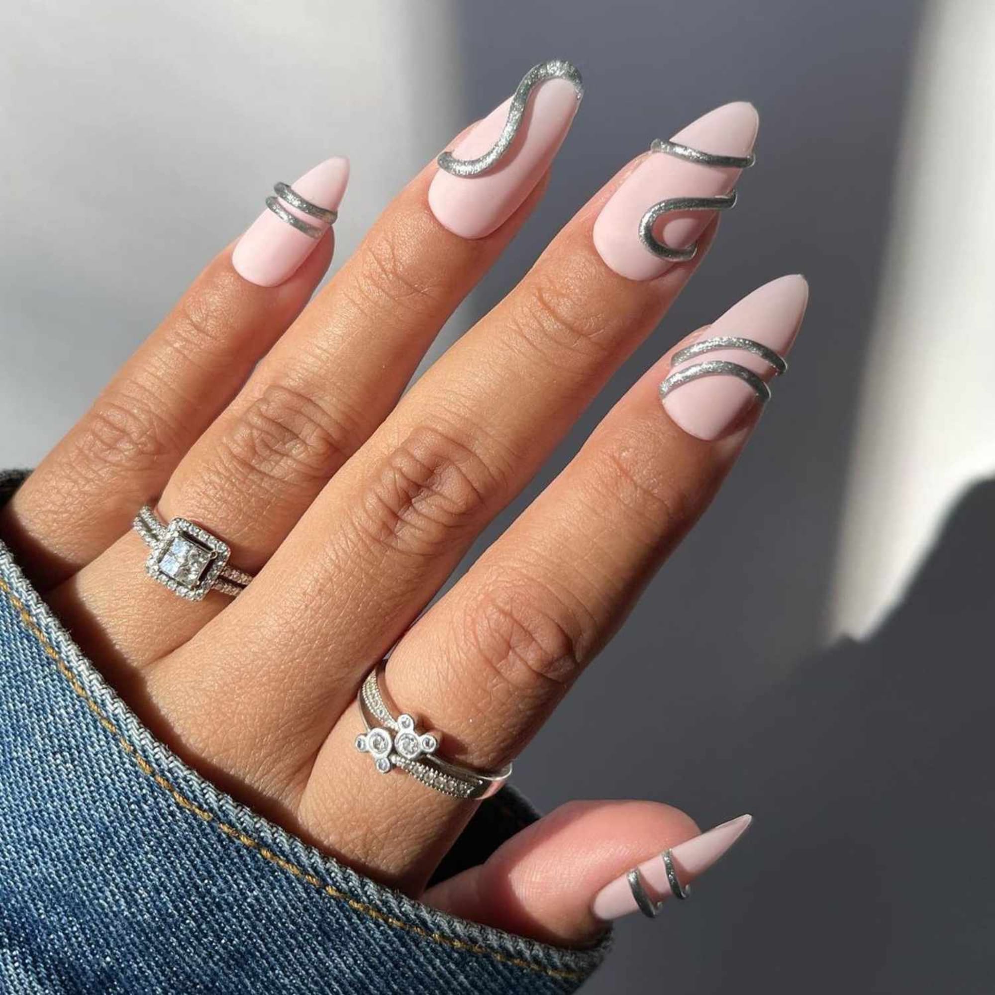 Pink and white ombre nails with silver glitter