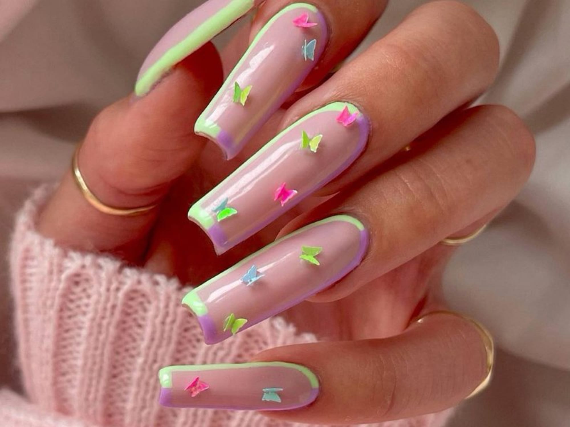 Neon butterfly and bow acrylic nails